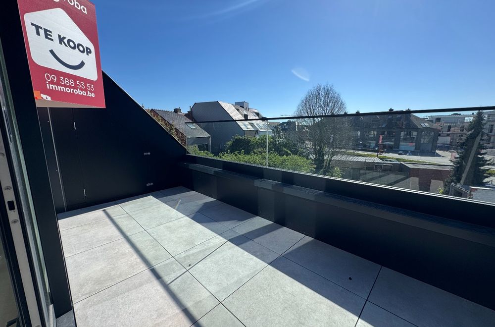 Vastgoedfoto van Nieuwbouwappartement (6%) te koop centrum Waregem: Dakappartement met 1 slaapkamer en leuk terras.